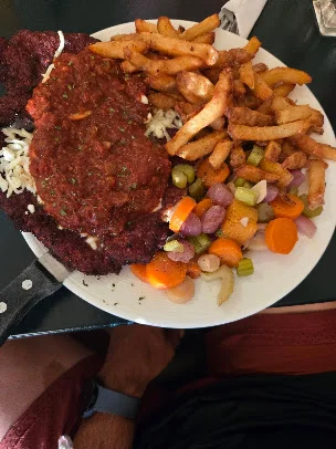 Schnitzel with fries and vegetables